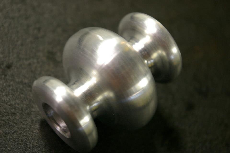 Turned aluminum spool with flanged ends
